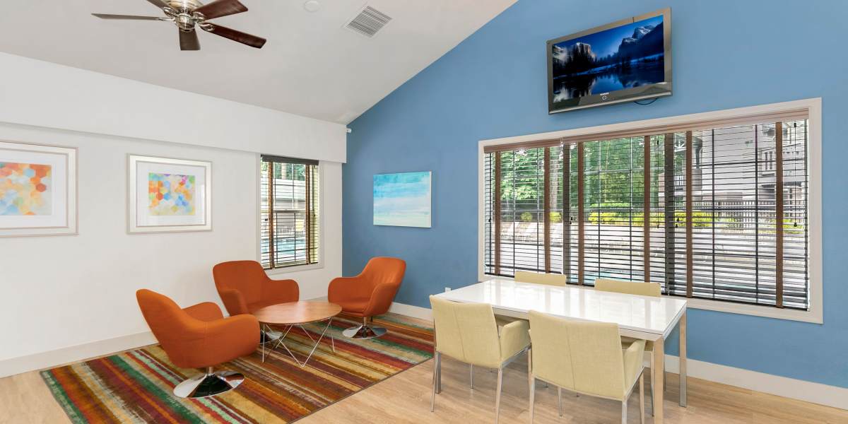 Business lounge with seating area and television at Autumn Chase Apartments in Vancouver, Washington