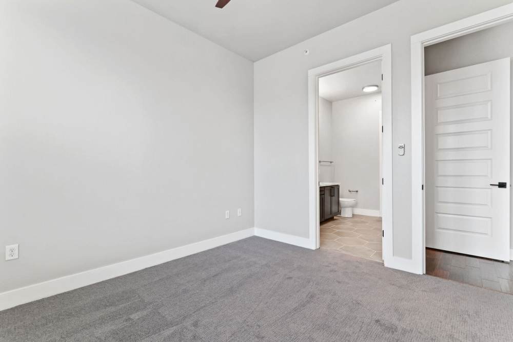Master unfurnished bedroom with access to bathroom at Kade in Dallas, Texas
