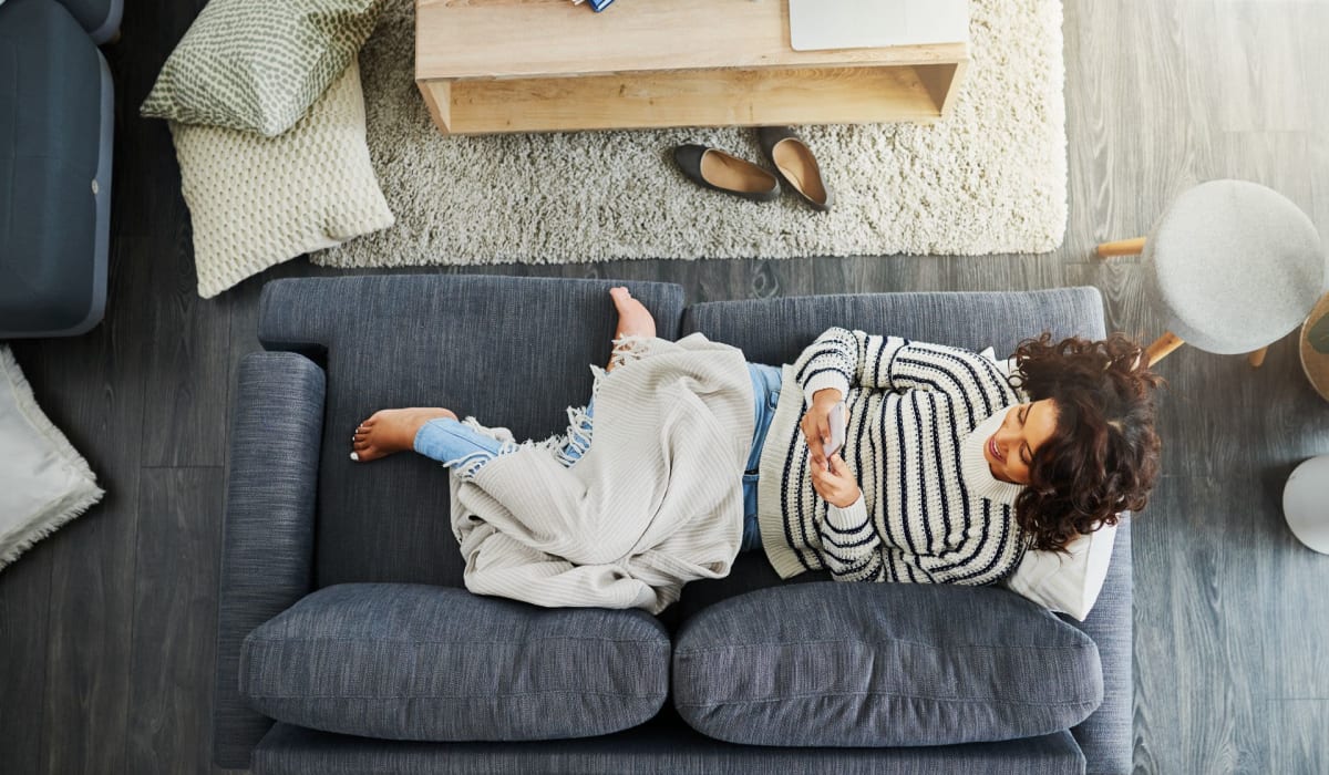 A resident relaxes in her apartment at Attain at Bradford Creek, Huntsville, Alabama