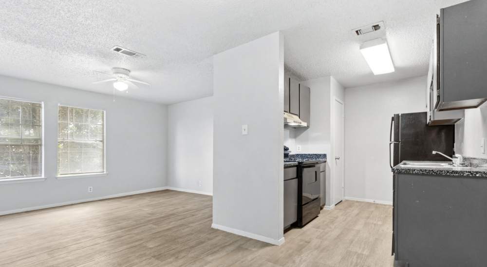 Wood-style floored apartment at Arbors of Taylor in Taylor, Texas