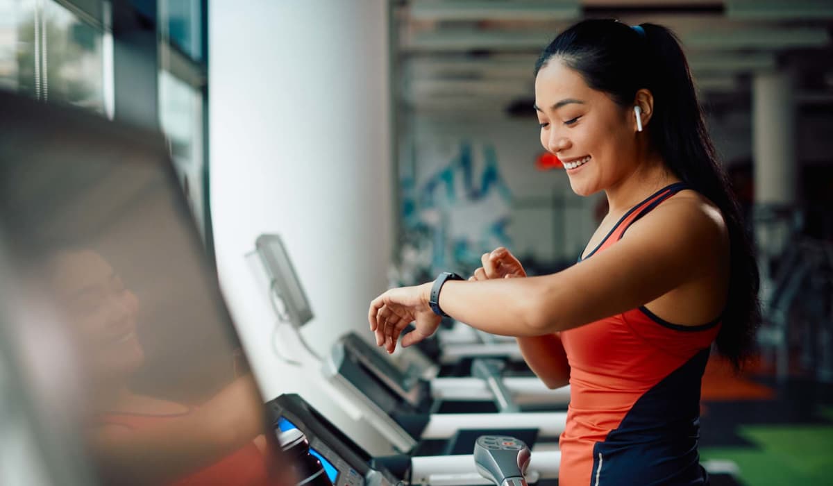 Resident on treadmill in the fitness center at Ridge Commons in Lafayette, Louisiana