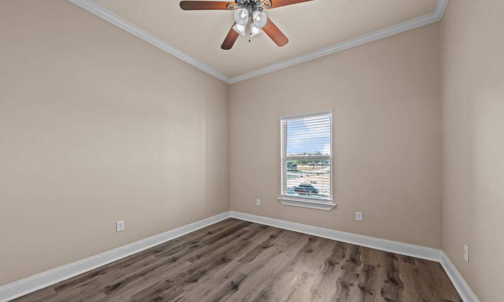 Bedroom with window at The Arbors of Mineola in Mineola. TX