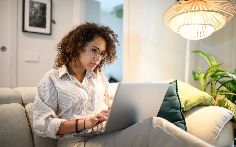 Resident accessing resident portal in her laptop at Carriage Court in Cincinnati, Ohio