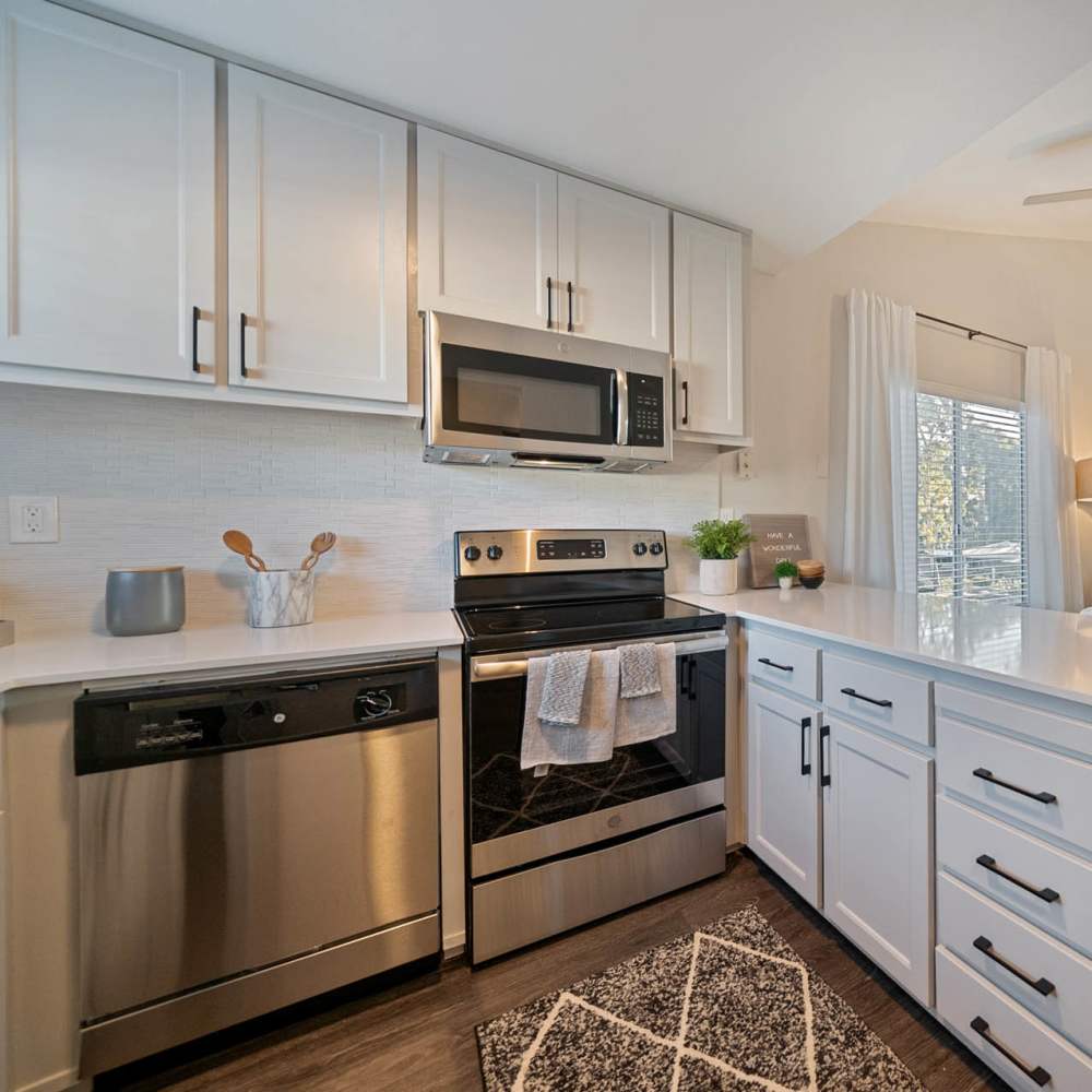 Kitchen with wooden cabinets at Bay Village in Vallejo, California