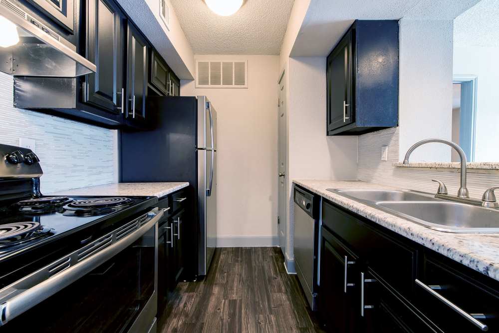 Kitchen with stainless-steel appliances at Ashmore in Pasadena, Texas