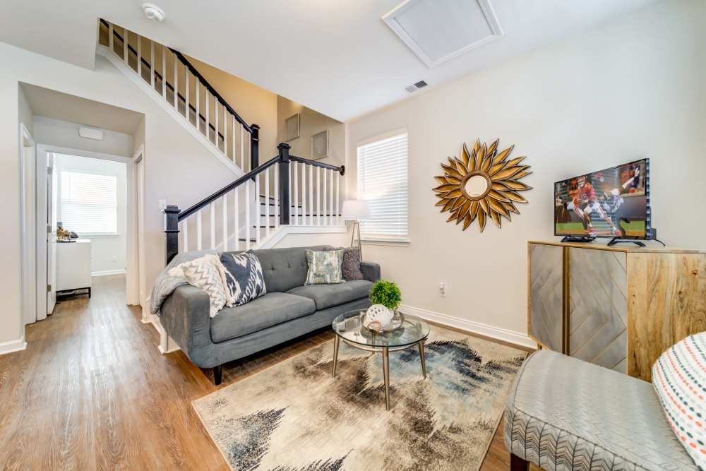 Modern apartment with steps inside and wooden flooring at Seaglass Cottage in North Myrtle Beach, South Carolina