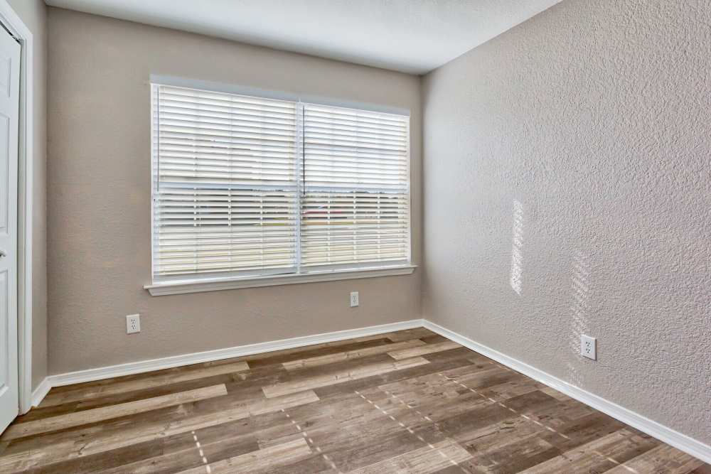 Spacious bedroom with large windows at The Gardens At Duncan Apartments in Duncan, Oklahoma