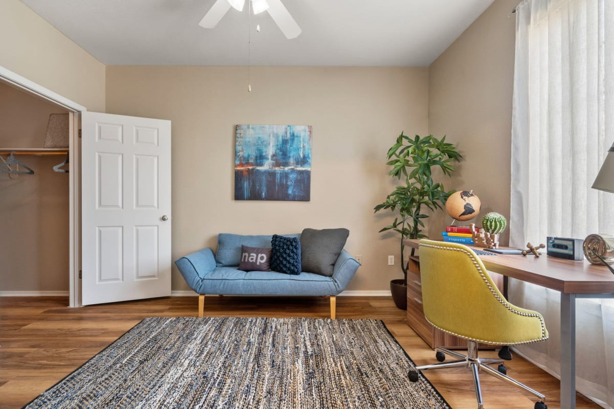 A den with a work table in an apartment at The Linq, Chandler, Arizona