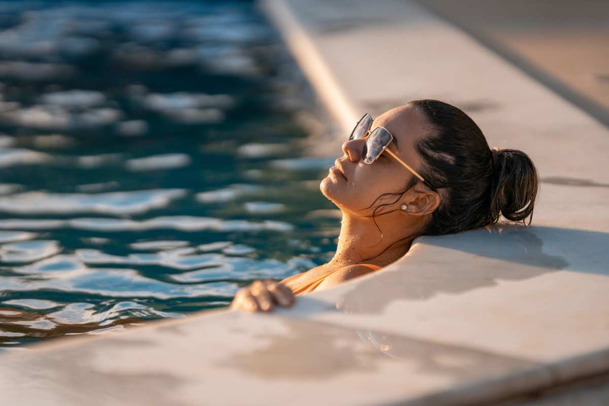 A resident relaxes in the pool at Summerwood on Towne Line, Indianapolis, Indiana