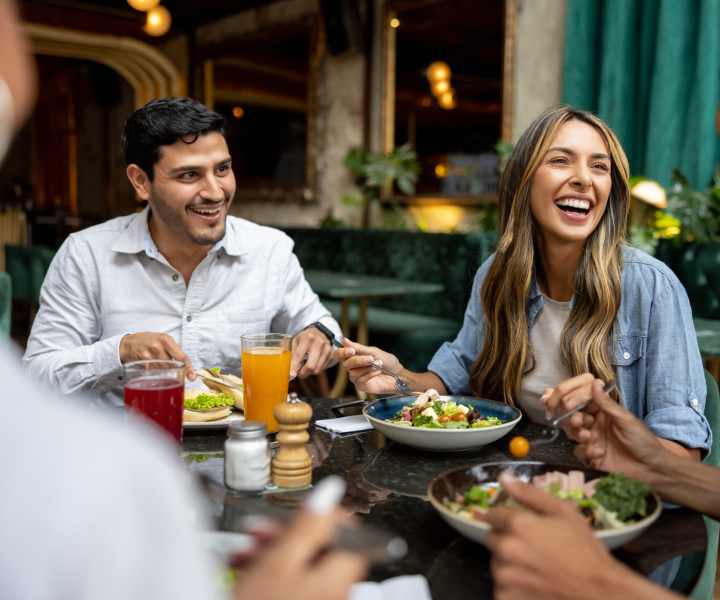 Residents enjoying a delicious meal near El Jardin Apartments in Hollywood, Florida