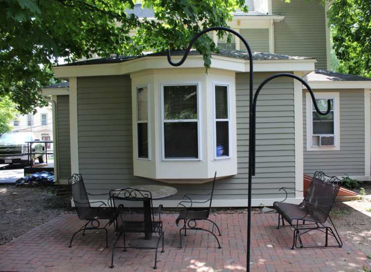 Outdoor community seating area at Hearth Elsie Frank House in Jamaica Plain, Massachusetts