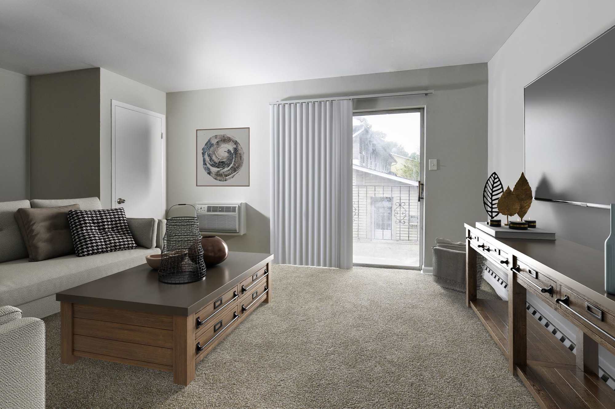 Model living room with balcony access at Lehigh Square in Allentown, Pennsylvania