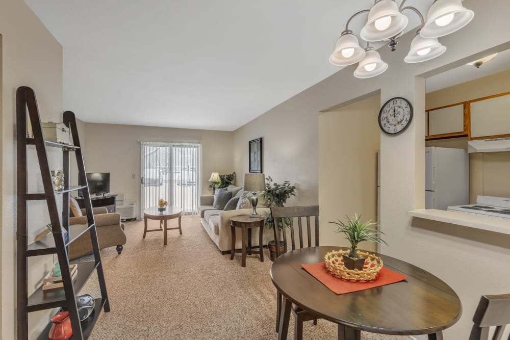 Apartment living room and dining area Truewood by Merrill, Modesto in Modesto, California.