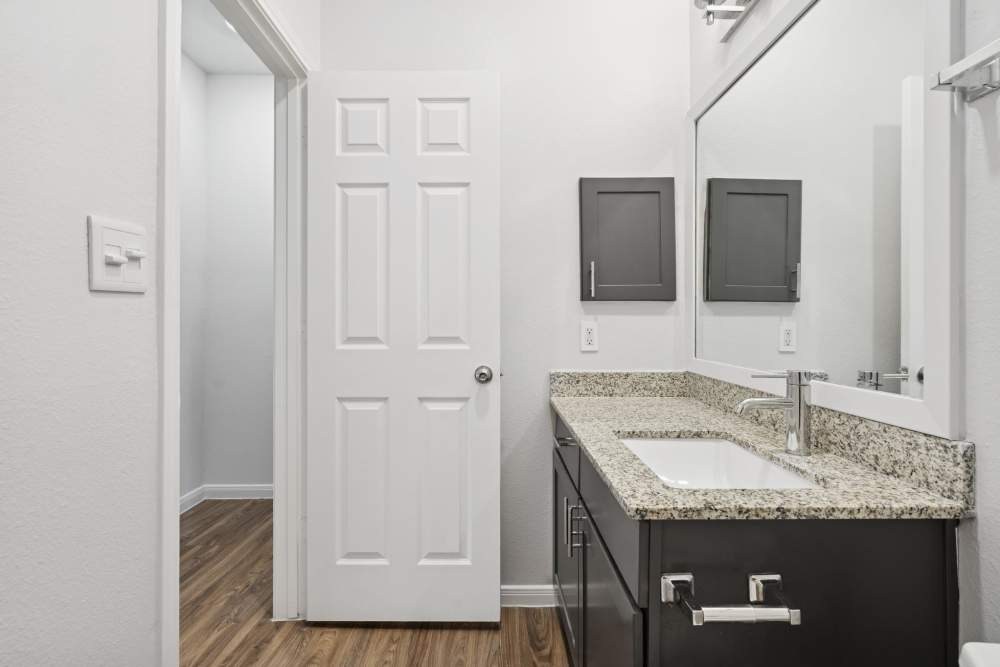 Bathroom with large mirror at Providence Estates in San Antonio, Texas