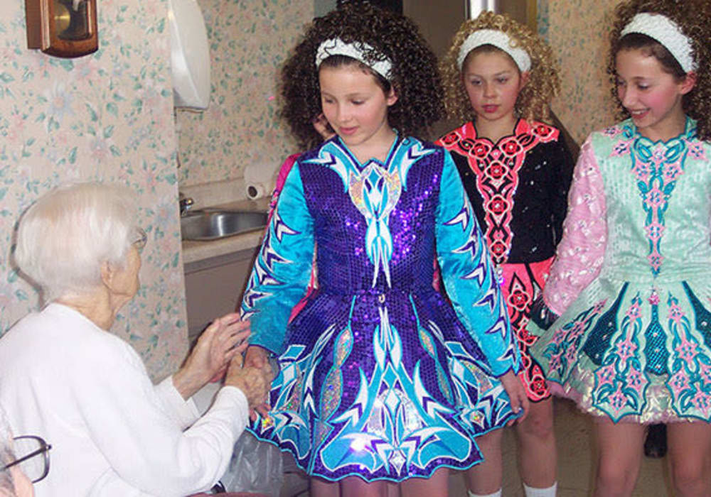 Resident congratulating young dancers on their recital at East Troy Manor in East Troy, Wisconsin