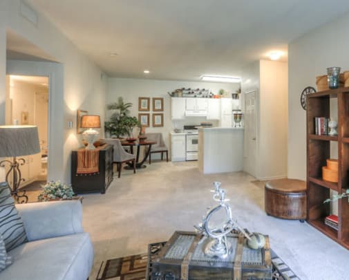 Beautiful well-lit model living room at Stone Creek Apartments in Killeen, Texas