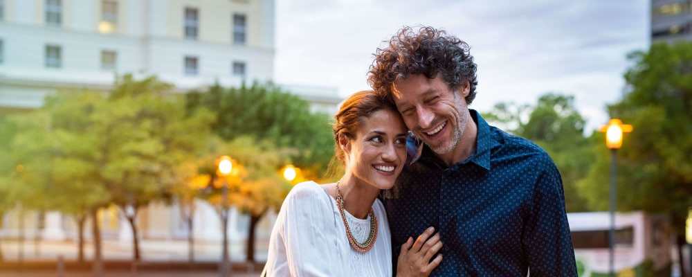 Happy couple walking near Manchester Court in Modesto, California