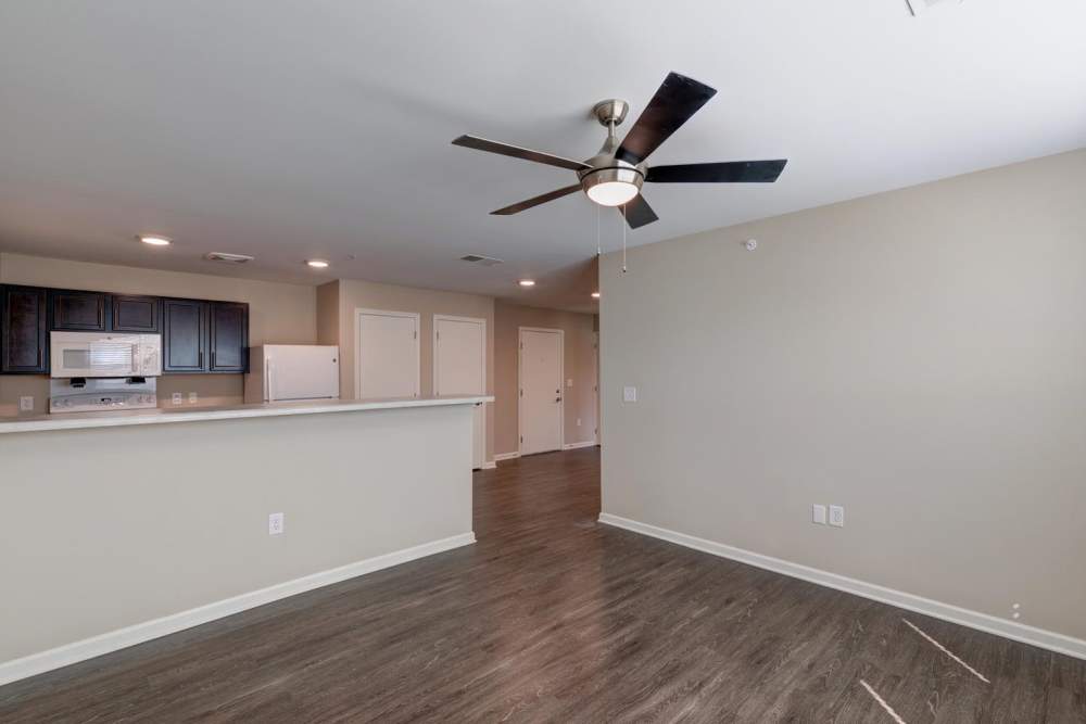 Living room with access to kitchen at Harpers Crossing in Plainfield. IN
