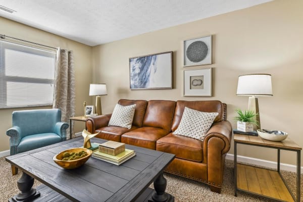 Beautifully decorated living room of model home at Hidden Creek Apartment Homes in Columbus, Ohio