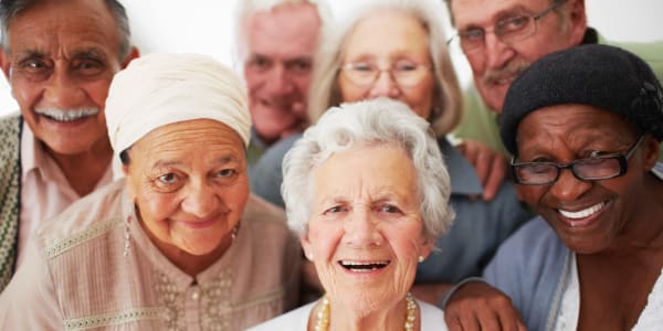 Happy residents posing for a group photo at Ingleside Communities in Mount Horeb, Wisconsin