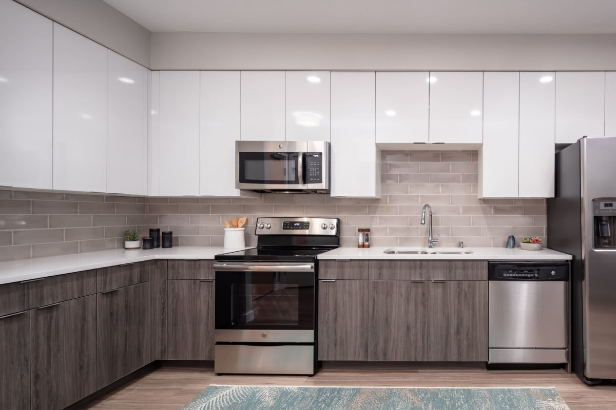 Apartment kitchen with stainless-steel appliances at Talo in Golden Valley, Minnesota