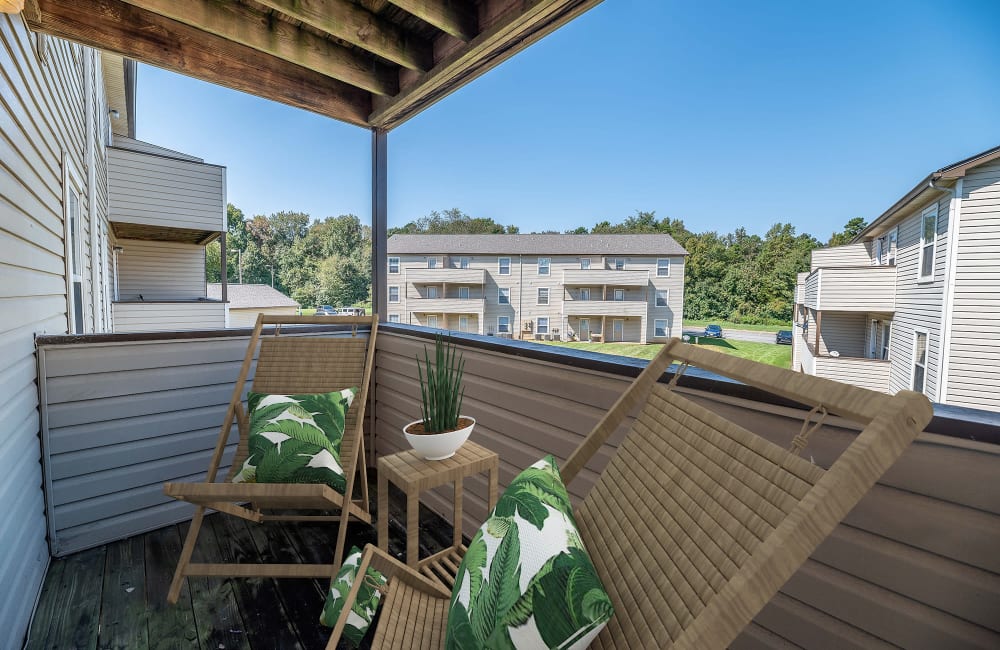 Exterior with private patio and lush lawn at Kannan Station Apartment Homes in Kannapolis, North Carolina