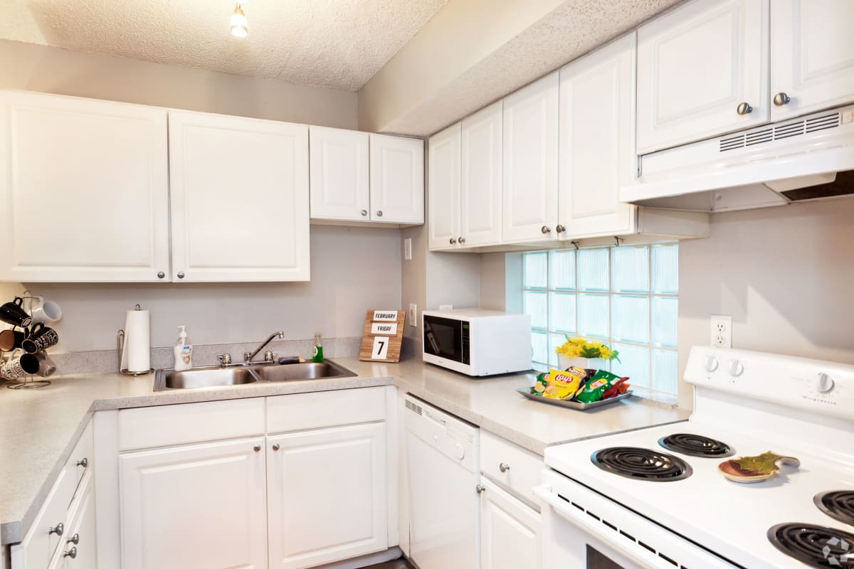 Kitchen with white cabinetry at On50 in Tampa, Florida