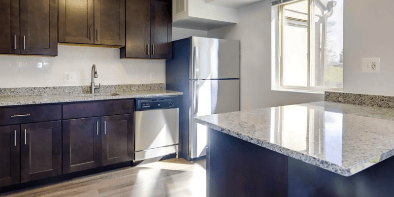 Model kitchen with granite countertops at Marrion Square Apartments in Pikesville, Maryland