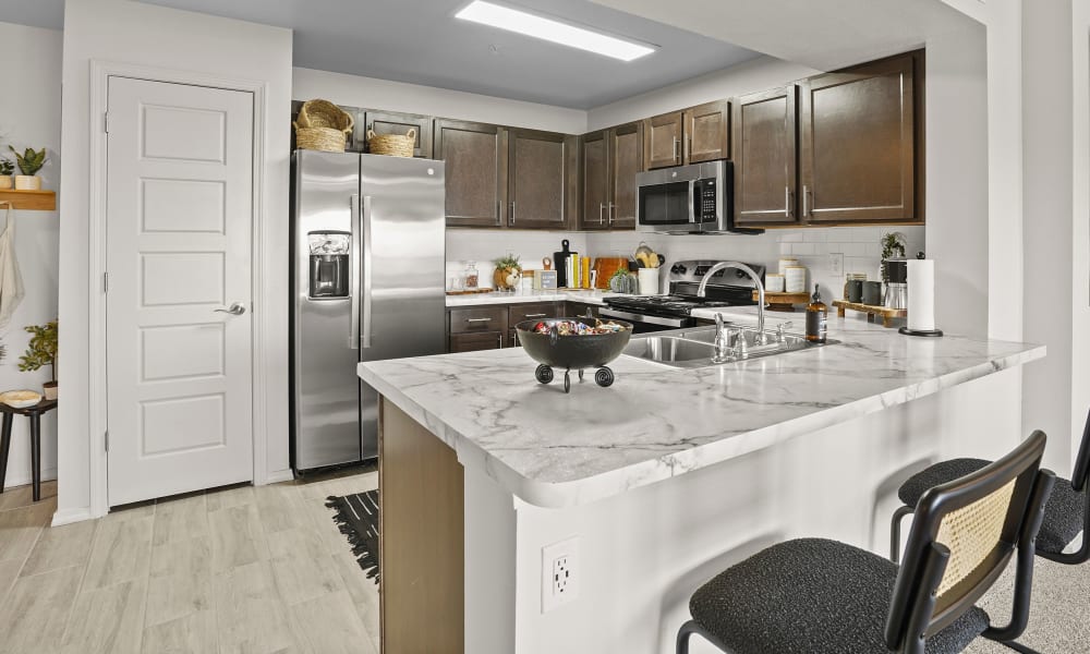 Bright and fully equipped kitchen at Center 301 Apartments in Belton, Missouri