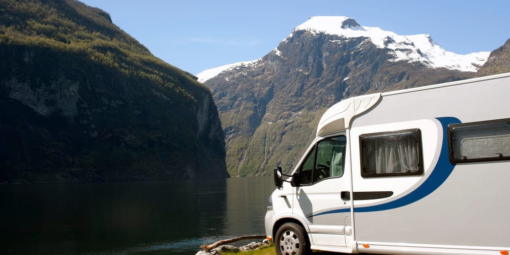 An RV parked in the mountains, when it's not parked at Trojan Storage of South Elgin in South Elgin, Illinois