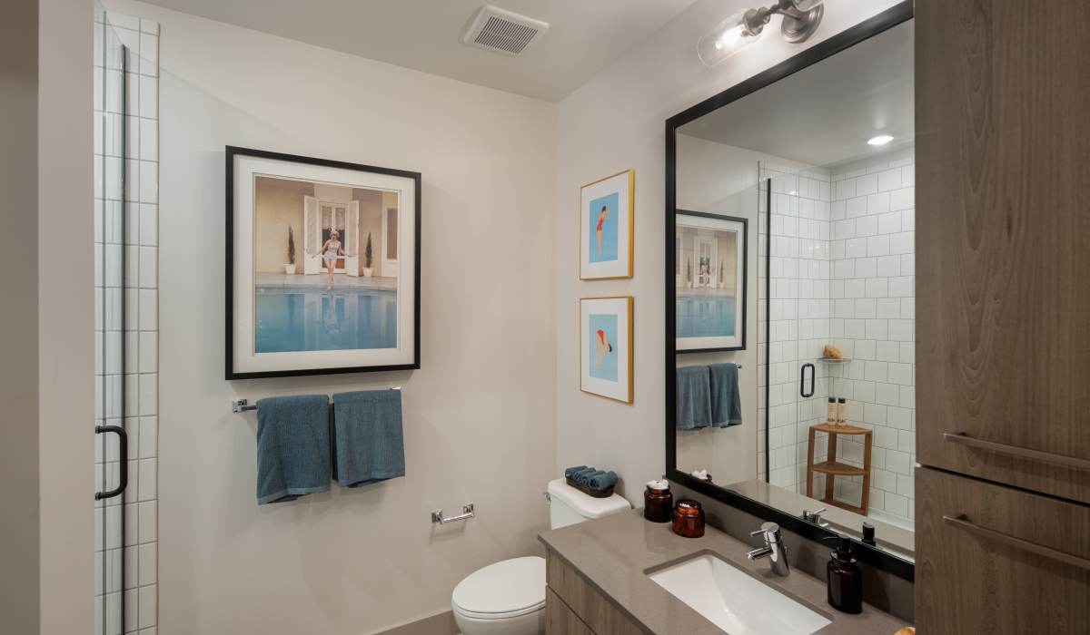 Shower with tile backsplash at Venable Durham Apartments in Durham, North Carolina
