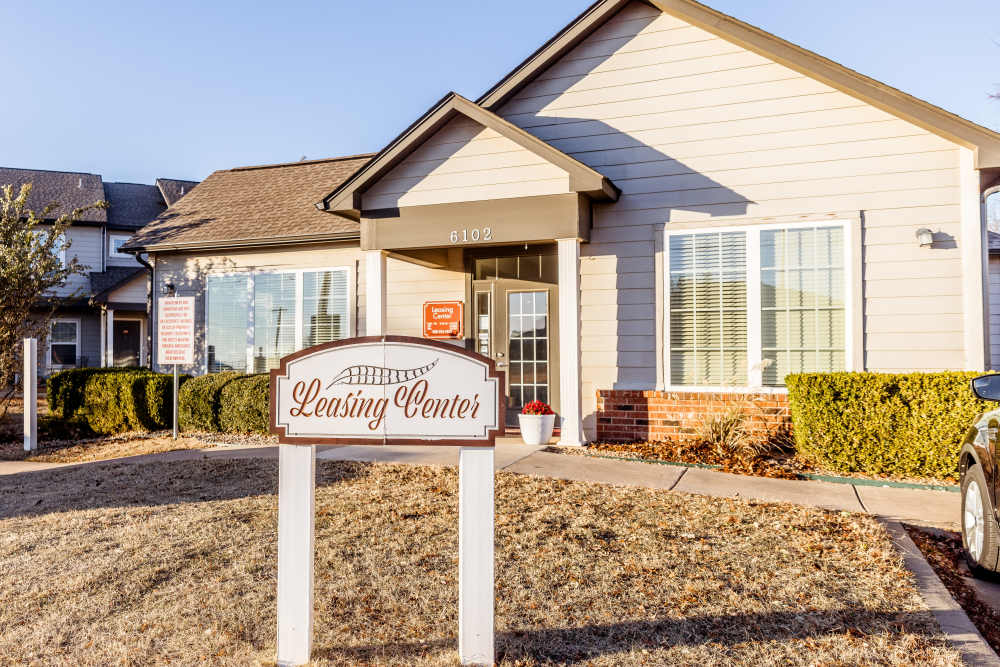 Exterior of building with apartment signage at Pheasant Run in Enid, Oklahoma.