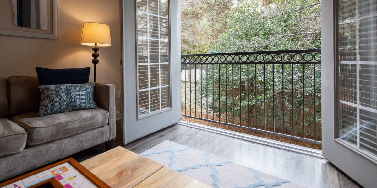 Living room with patio access at Marq Perimeter in Atlanta, Georgia