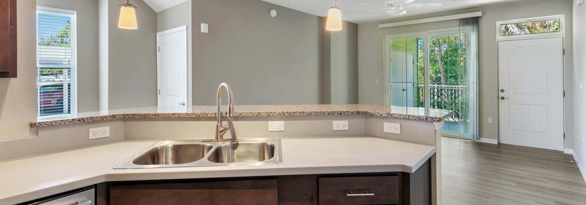 Stylish kitchen featuring modern finishes and natural light at Lemon Bay Apartments in Englewood, Florida.