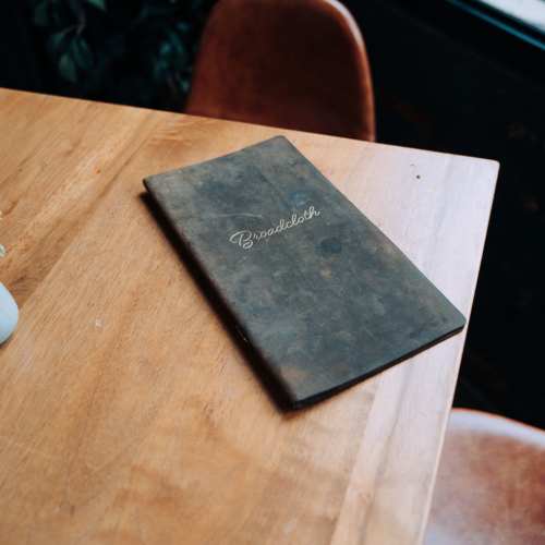 Book on a table at The Elysian at Stonefield in Charlottesville, Virginia