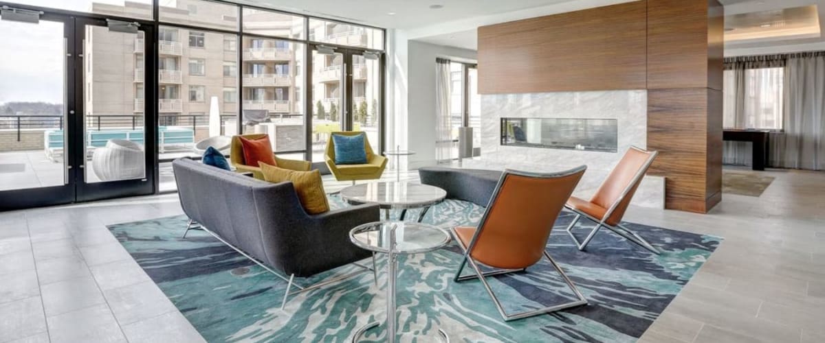 Communal sitting area with large windows at Solaire 7077 Woodmont in Bethesda, Maryland