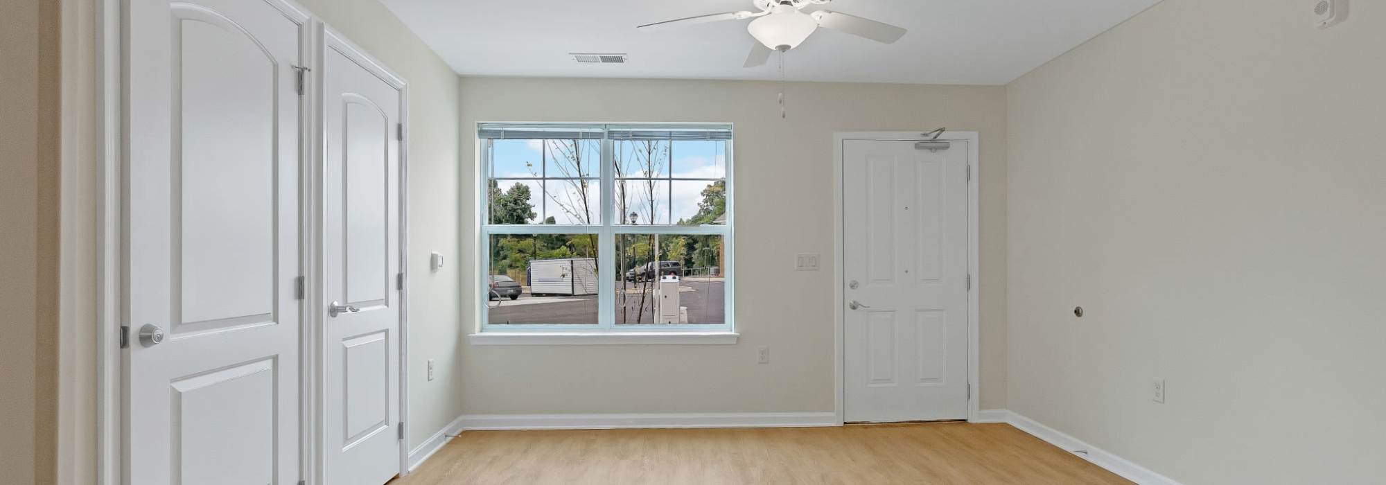 Living room with ceiling fan at Robinson Overlook in Columbia, Maryland