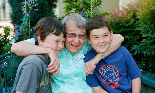 A resident and her grandchildren at Merrill Gardens. 