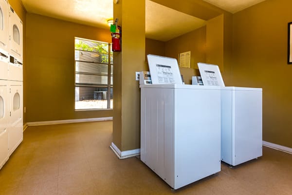 Laundry room at Riverstone Apartments in Bryan, Texas