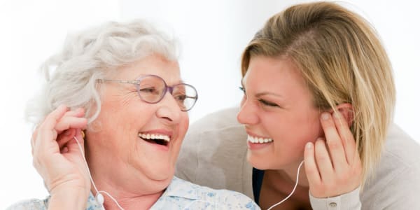 Resident and daughter listening to music together at East Troy Manor in East Troy, Wisconsin