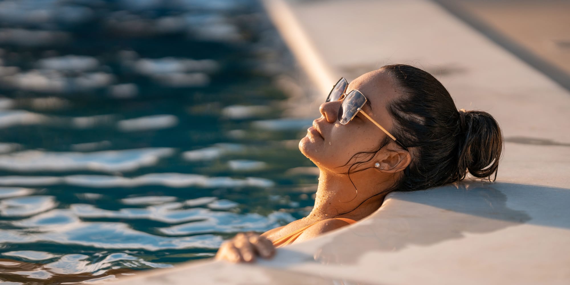 Resident enjoying the pool at La Mesa Gardens in La Mesa, California