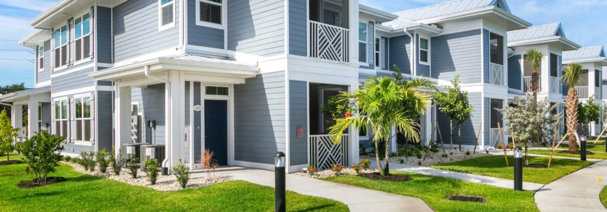 Lush green view of apartment garden at The Bergamot Apartments On 780 in Sarasota, Florida