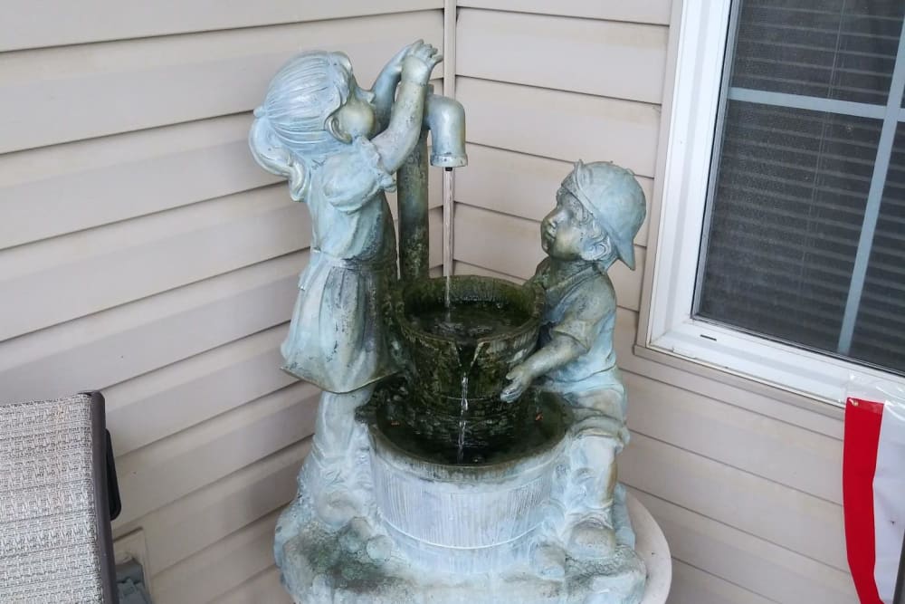 Ceramic fountain featuring children at Arlington Place of Red Oak in Red Oak, Iowa
