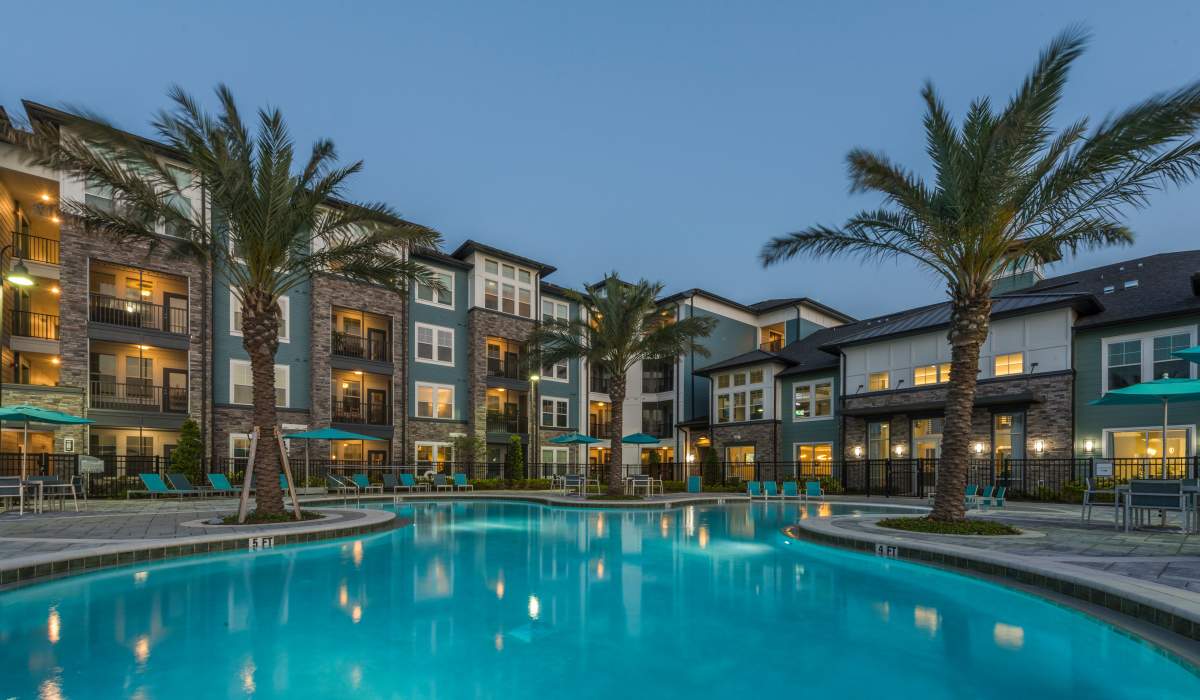 Swimming pool in a twilight view at The Addison on Millenia in Orlando, Florida