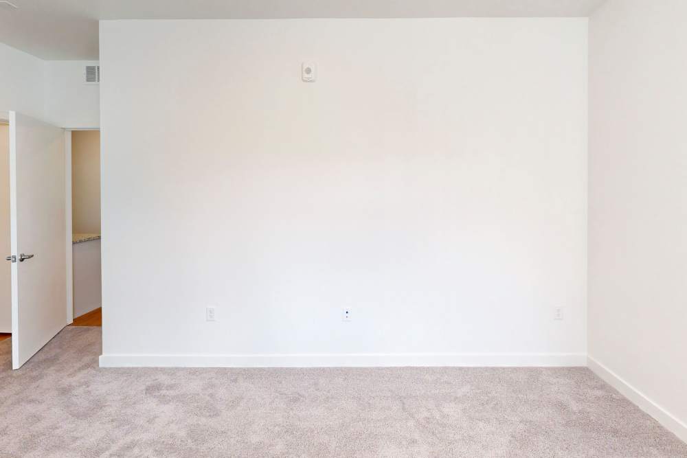 Unfurnished bedroom with carpet flooring at The Rose on Colfax in Denver,Colorado