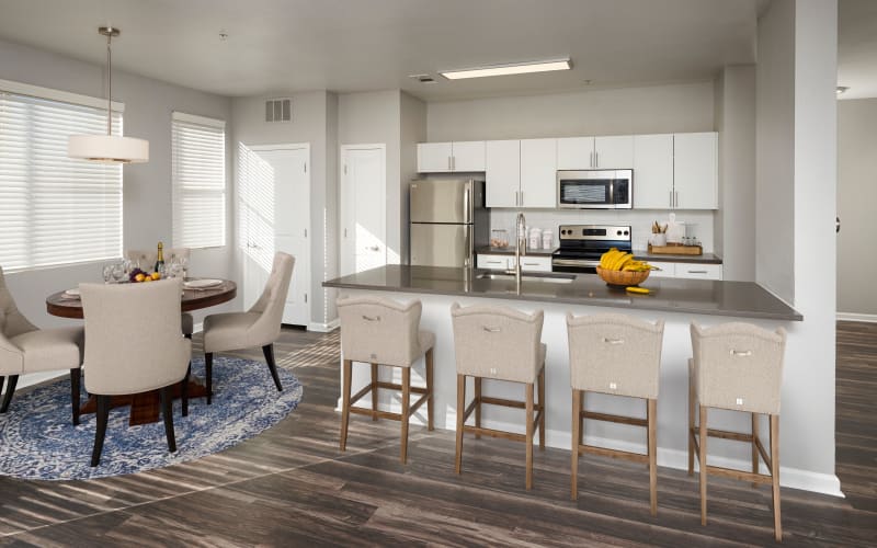 Spacious and bright dining room and kitchen at The Rail at Inverness in Englewood, Colorado
