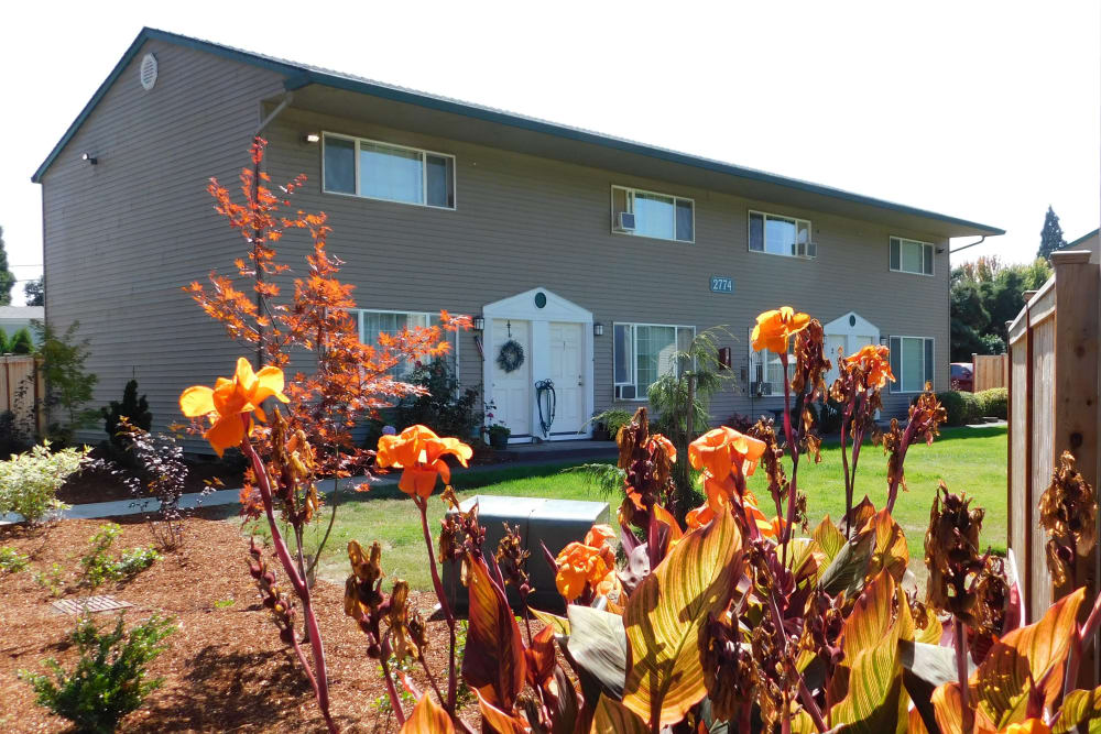 Exterior of apartments with flowers at Lakeside Apartments in Albany, Oregon