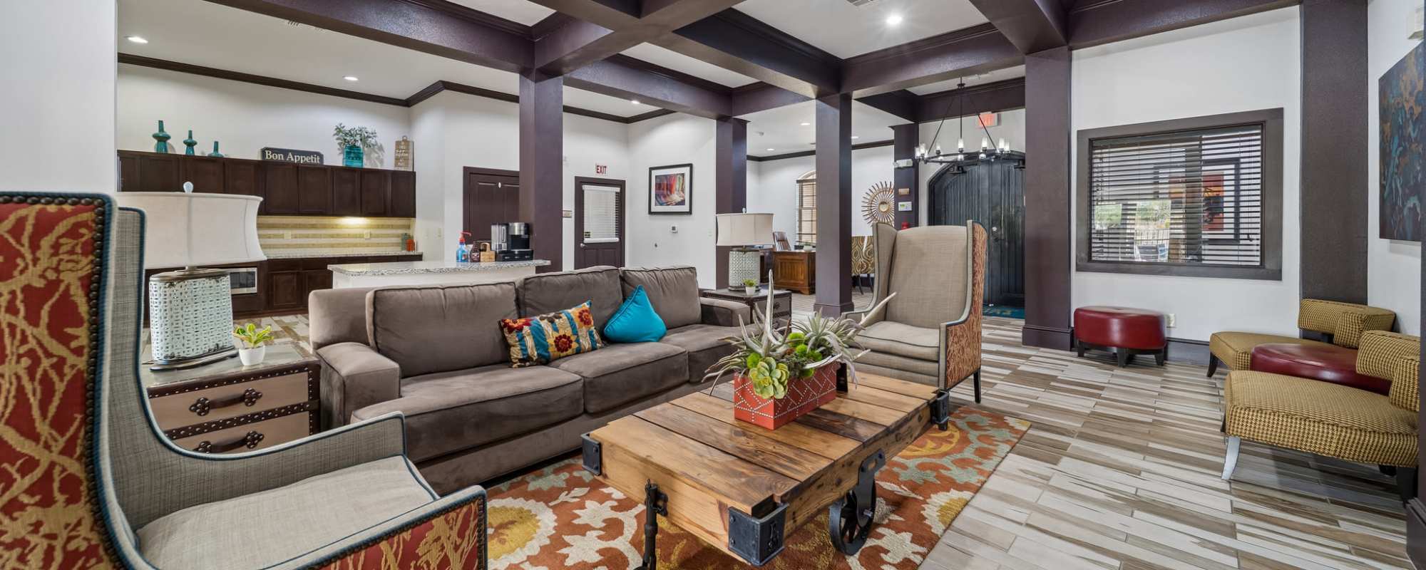 Furnished clubhouse with kitchen in background at Sunset Lodge in Odessa, Texas