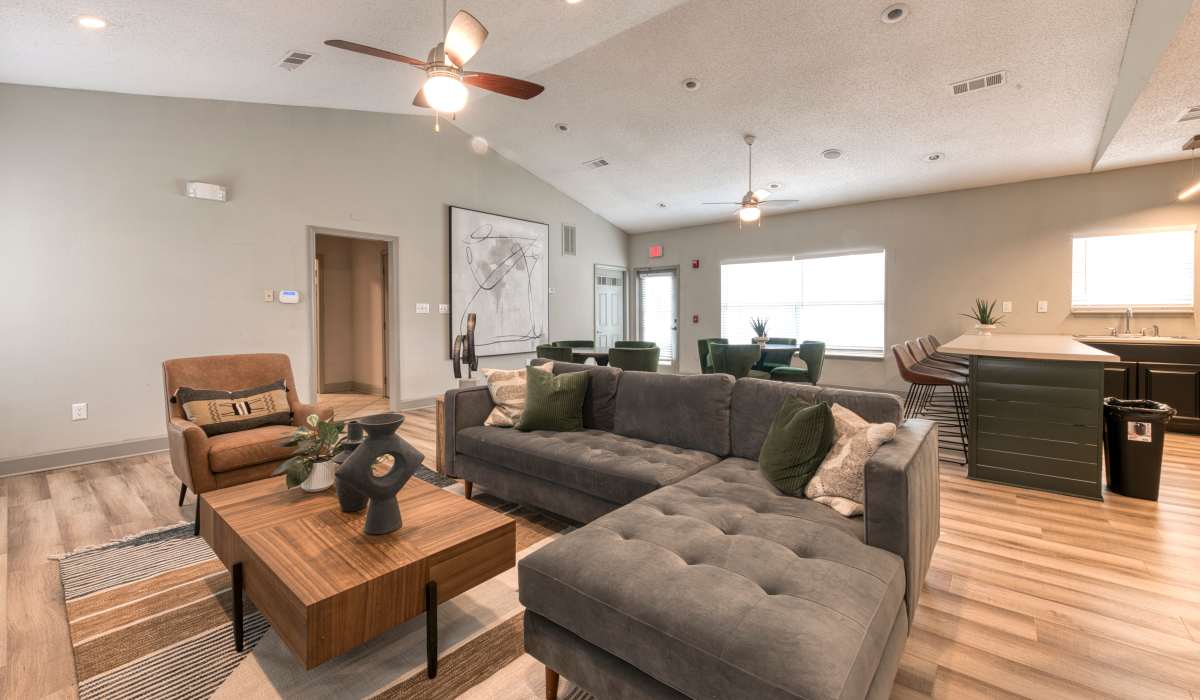 Clubhouse with lounge seating and center table at Eastlake Gardens in Decatur, Georgia