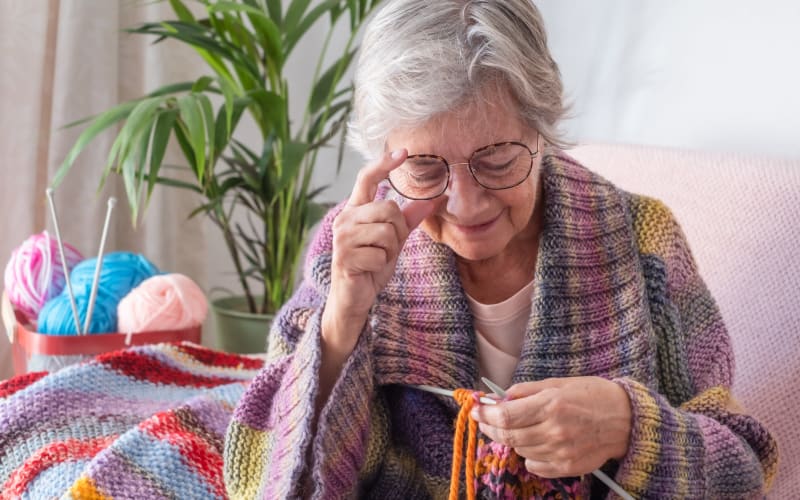 Resident knitting at Grand Villa of St. Petersburg in St. Petersburg, Florida